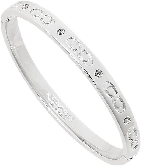 coach kissing c hinged bangle.